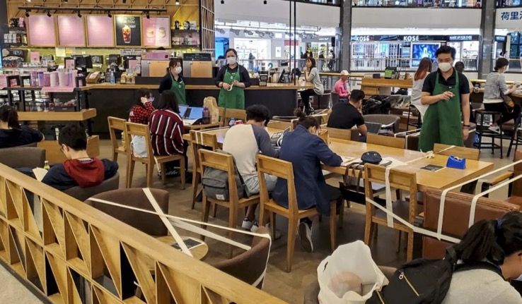 Starbucks in China enforcing social distancing by blocking off chairs