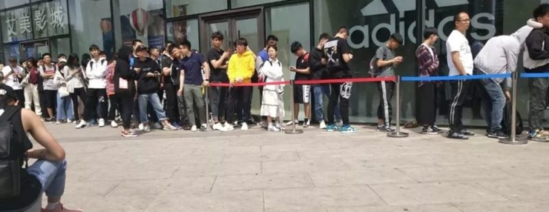 Chinese shoppers lined up outside Adidas ready to purchase Yeezy shoes