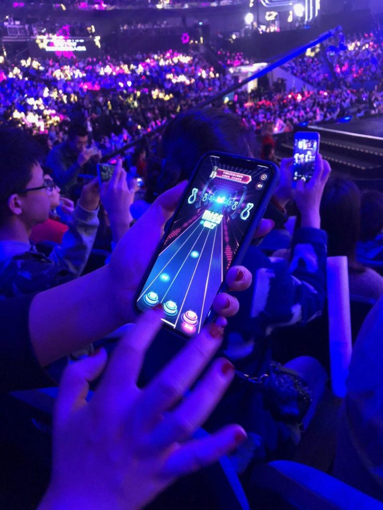 an audience playing an interactive game at Alibaba’s Global Shopping Festival Gala