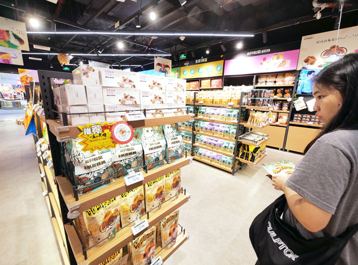  A consumer in Guangdong province searching for snacks at a store. health awareness in China