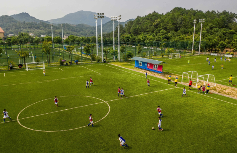 Youth players from the R&F and Ajax partner football academy train in Guangzhou.